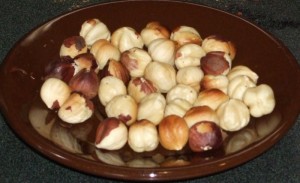 unroasted, peeled hazelnuts Plate of unroasted, peeled hazelnuts
